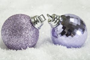 7883185-Close-up-of-two-mauve-Christmas-baubles-on-fake-snow-leaning-towards-eachother-as-though-in-love-or--Stock-Photo